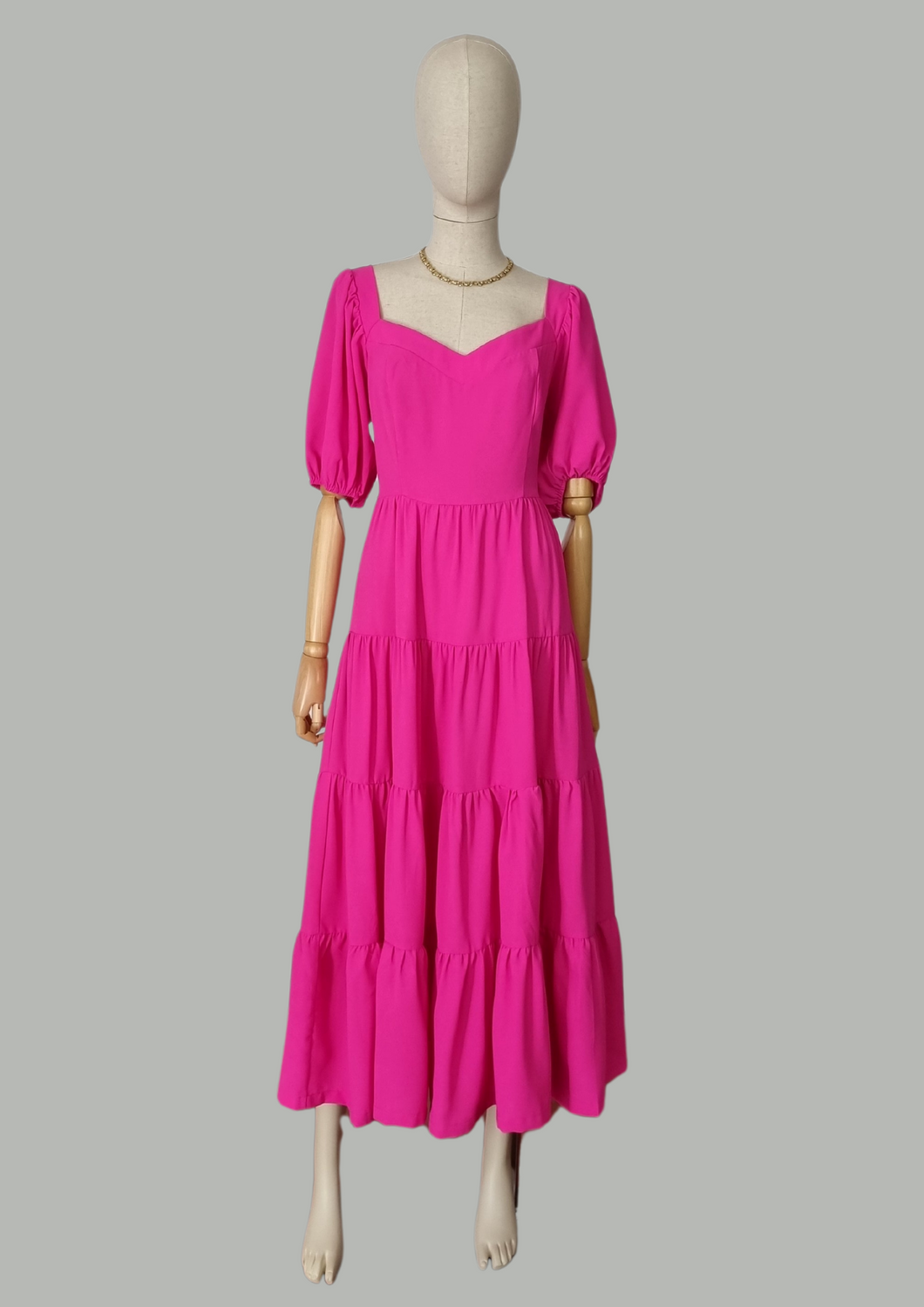 Vestido midi manga bombacha rosa